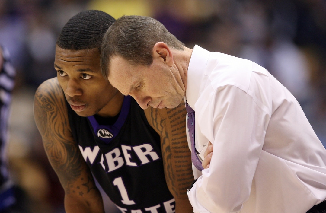 (Steve Griffin  |  Tribune file photo). Weber State head coach Randy Rahe listens to to Damian Lillard during first-half action at BYU versus Weber State in 2011.