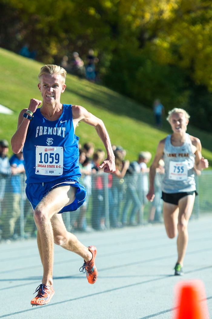 (Chris Detrick  |  The Salt Lake Tribune) Fremont senior Bronson Winter passes Lone Peak senior Justin Hartshorn to win the 6A boy's state cross-country meet with a time of 15:09.3 at Sugar House Park and Highland High School Wednesday, October 18, 2017. 