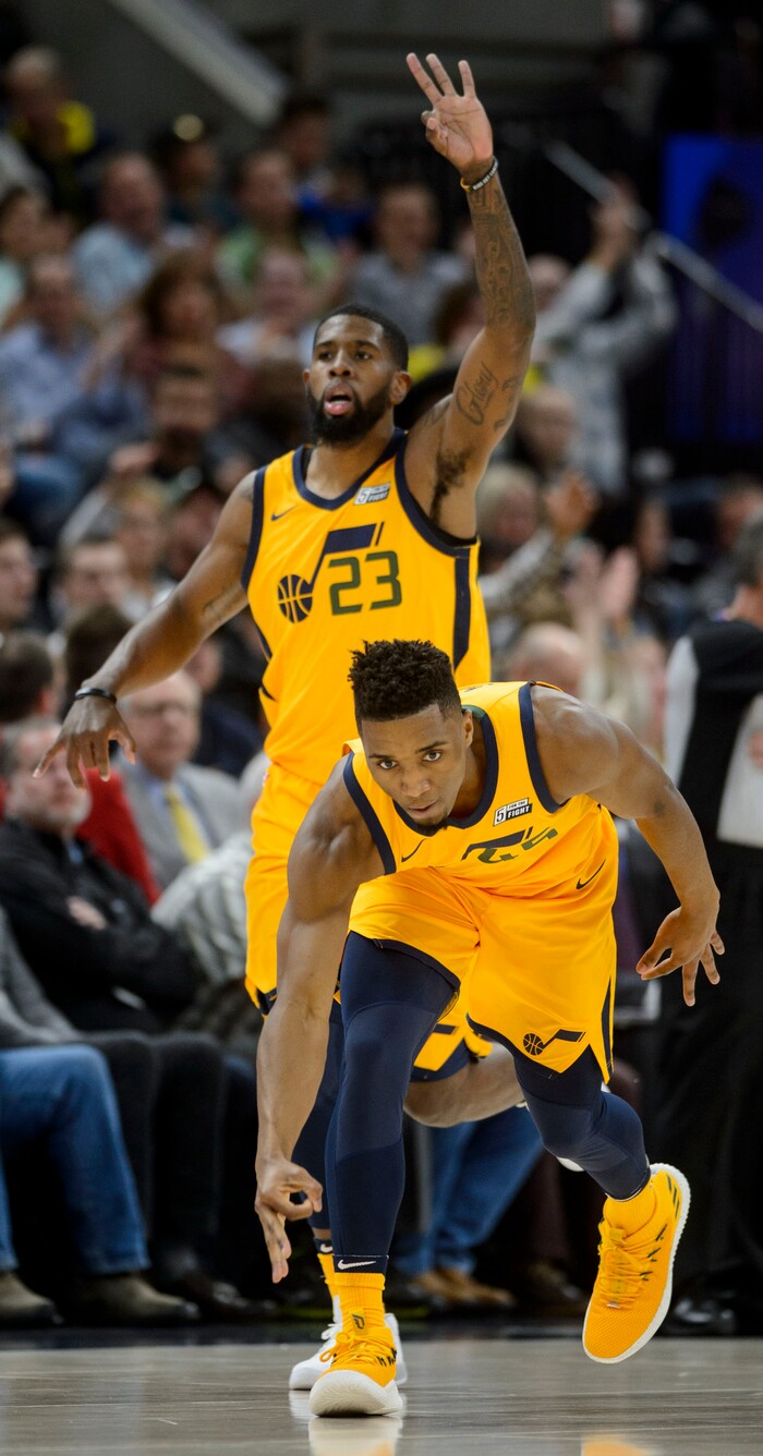 (Steve Griffin  |  The Salt Lake Tribune) Utah Jazz guard Donovan Mitchell (45) gets low as he runs low as he holds out three fingers after nailing a three-pointer late in the fourth quarter during the Utah Jazz versus Denver Nuggets NBA basketball game at Vivint Smart Home Arena  in Salt Lake City Tuesday November 28, 2017.