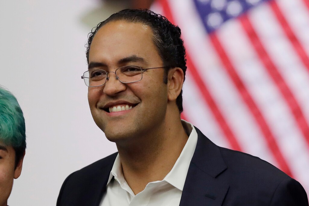 (Eric Gay | AP file photo) Rep. Will Hurd, R-Texas, right, poses for photos at the Texas A&M-San Antonio on Oct. 23, 2019. Hurd announced on Aug. 1, 2019, he will not seek reelection in 2020. (AP Photo/)