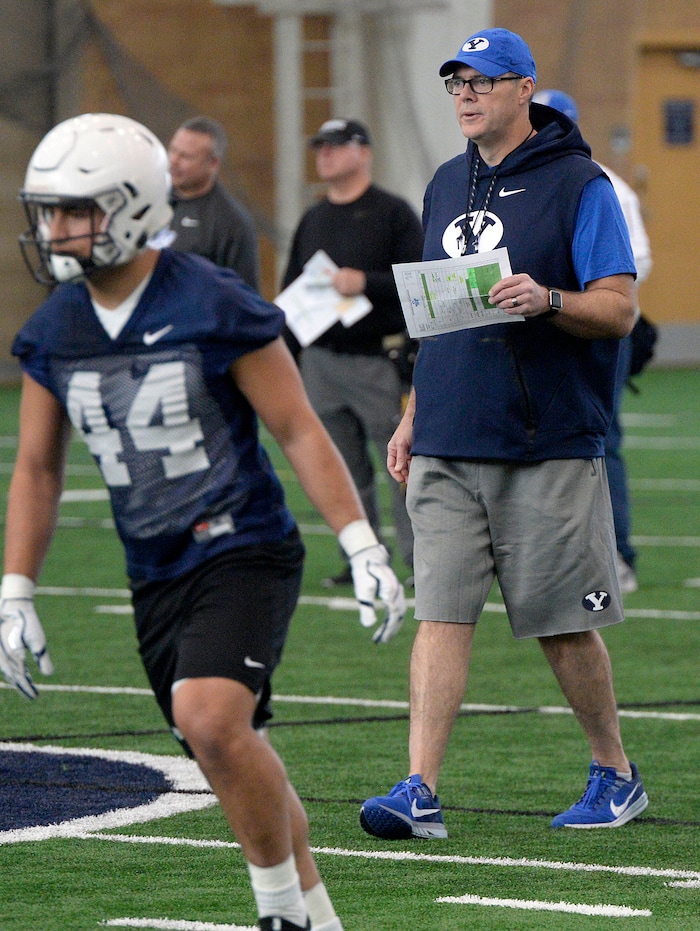 (Al Hartmann | The Salt Lake Tribune)
BYU opened spring football camp on Monday March 5 in the indoor playing facility with some new offensive coaching staff, like offensive coordinator Jeff Grimes, right.