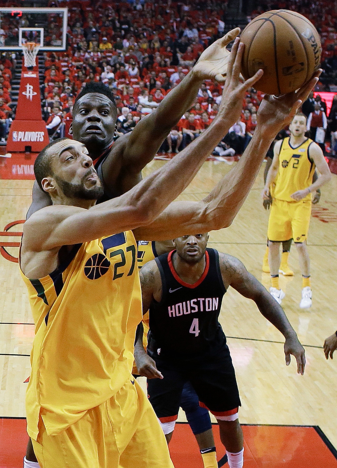 Utah Jazz center Rudy Gobert (27) and Houston Rockets center Clint Capela vie for a rebound during the first half in Game 1 of an NBA basketball second-round playoff series, Sunday, April 29, 2018, in Houston. (AP Photo/Eric Christian Smith)