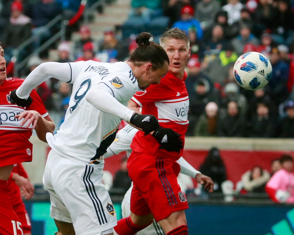 Chicago Fire midfielder Bastian Schweinsteiger (31), watches as Los Angeles Galaxy forward Zlatan Ibrahimovic (9), scores a goal during the first half of an MLS soccer match in Bridgeview, Ill., on Saturday, April 14, 2018. (Nuccio DiNuzzo/Chicago Tribune via AP)