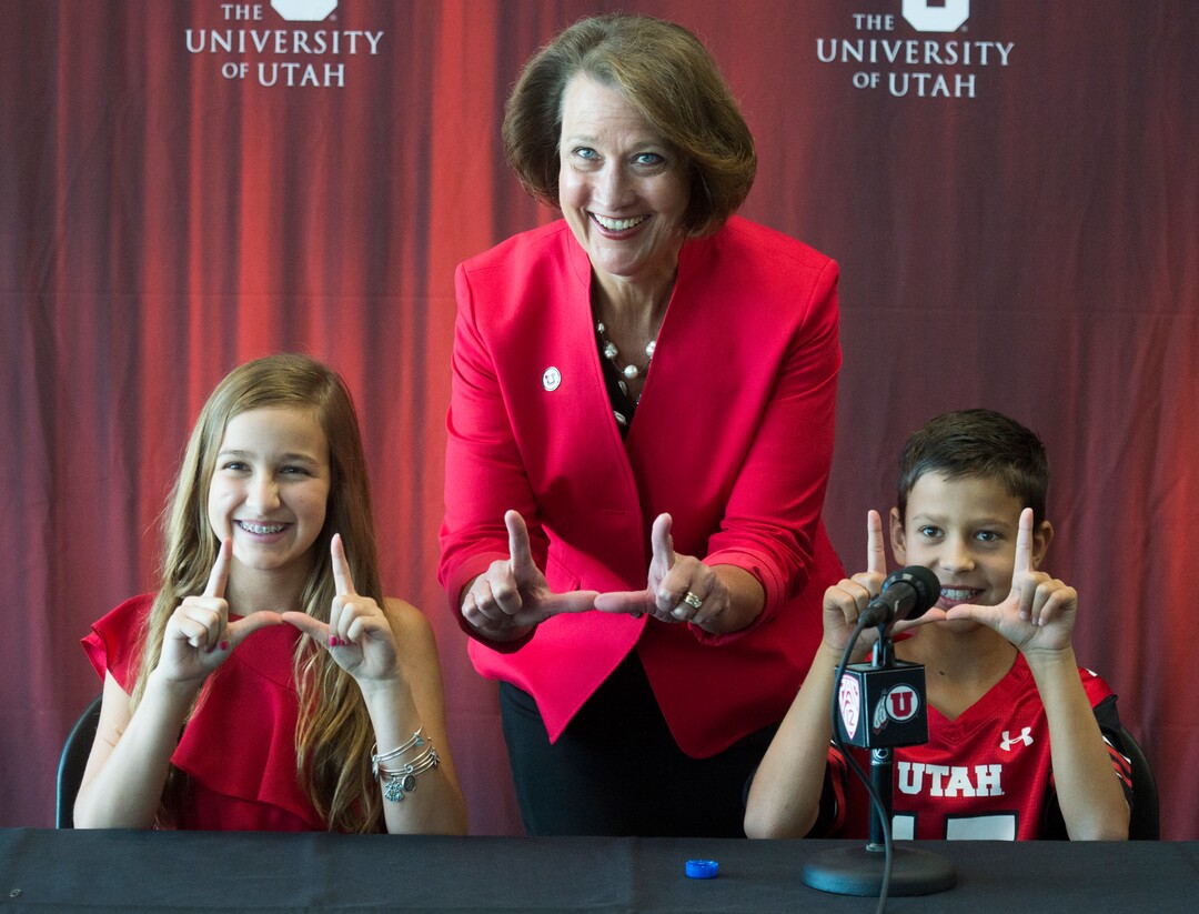 (Rick Egan  |  The Salt Lake Tribune)   University of Utah President Ruth V. Watkins poses with Mark Harlan, the new athletic director's children Savanah 13, and Austin, 10, during a news conference at the Rice-Eccles Stadium,  Monday, June 4, 2018.