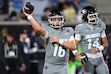 Colorado quarterbacks Isaac Wilson, front, and Kaneal Sweetwyne warm up before an NCAA college football game against Utah Saturday, Oct. 17 2026, in Boulder, Colo. (AP Photo/David Zalubowski)