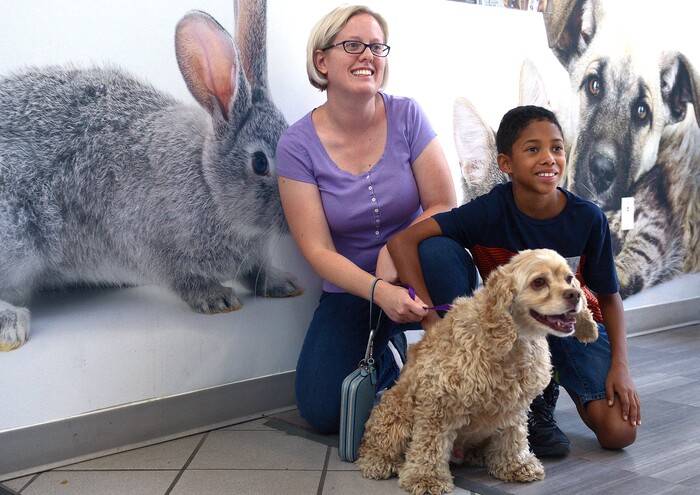 (Leah Hogsten  |  The Salt Lake Tribune) Roman Morehead, 9, and his mother Christine are all smiles after adopting "Tucker" during the Humane Society's weeklong adoption event, Clear the Shelters, Saturday, August 19, 2017, a nationwide drive to adopt out cats and dogs.