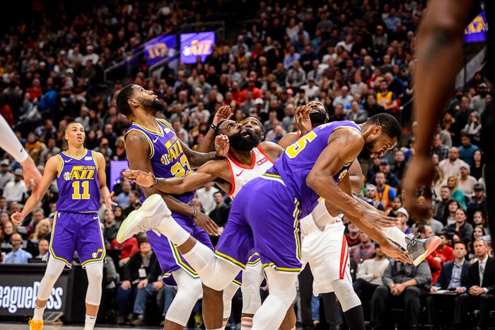 (Trent Nelson | The Salt Lake Tribune)  
Houston Rockets guard James Harden (13) collides with Utah Jazz forward Derrick Favors (15). The Utah Jazz host the Houston Rockets, NBA basketball in Salt Lake City on Thursday Dec. 6, 2018.