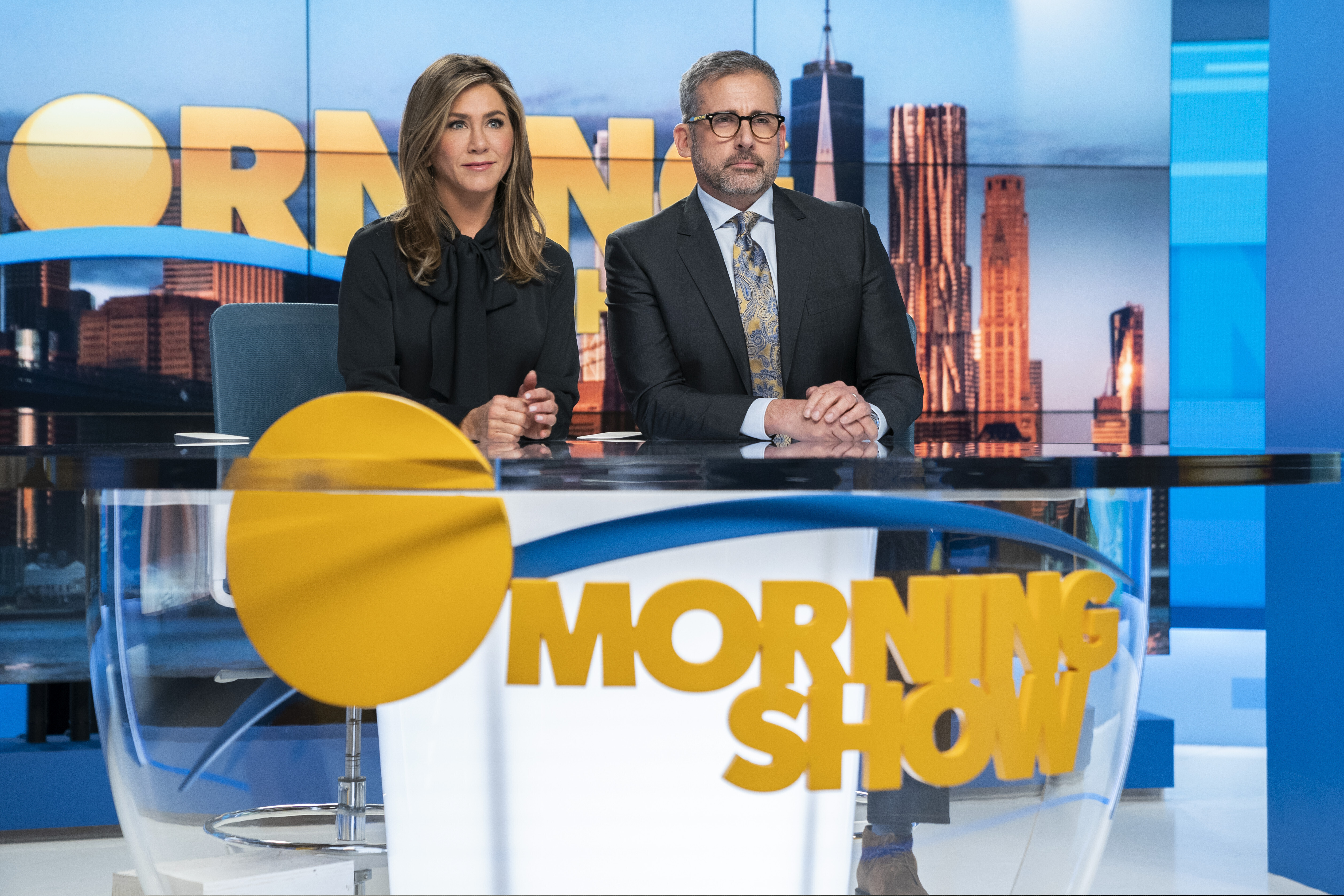 This image released by Apple TV Plus shows Jennifer Aniston, left, and Steve Carell in a scene from "The Morning Show," debuting Nov. 1, as part of the first wave of series that will launch the Apple TV Plus streaming service. (Hilary B. Gayle/Apple TV Plus via AP)
