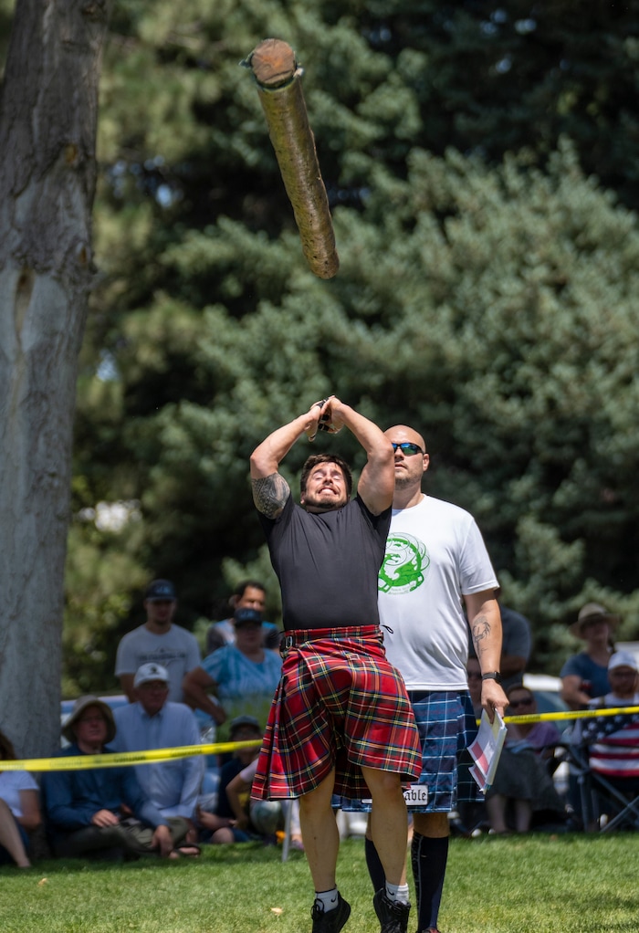 (Rick Egan | The Salt Lake Tribune) Dane Wigington from Saratoga Springs, competes in the Caber Toss in the Highland games competition, at the Payson Scottish Festival, on Saturday, July 9, 2022.
