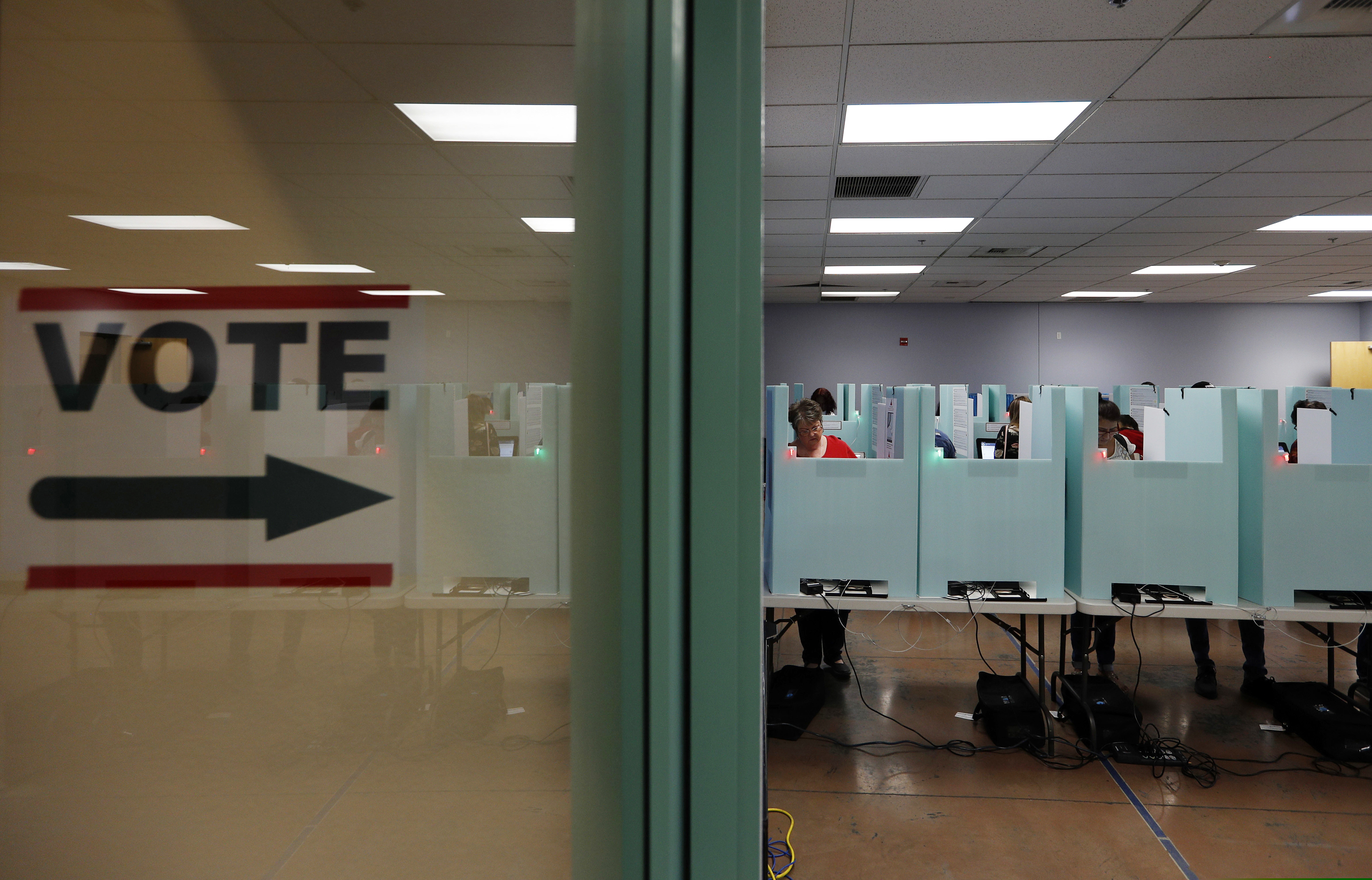 (John Locher | AP file photo)  People vote at a polling place in Las Vegas on Nov. 6, 2018.