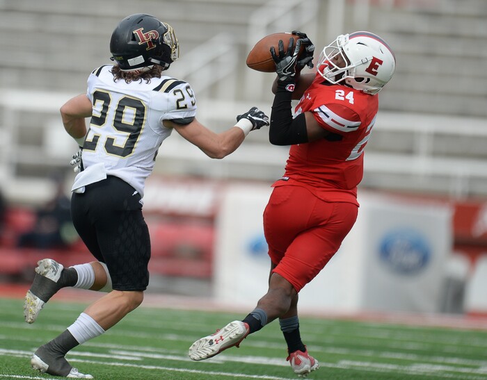 (Francisco Kjolseth | The Salt Lake Tribune) Jacob Mumford of Lone Peak puts the pressure on Jaylon Vickers of East in their class 6A semifinal game at Rice-Eccles Stadium, Friday, Nov. 10, 2017.