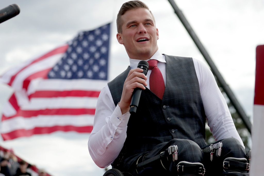 (Chris Seward | AP) U.S. Rep. Madison Cawthorn, R-N.C., speaks to the crowd before former President Donald Trump takes the stage at a rally Saturday, April 9, 2022, in Selma, N.C.