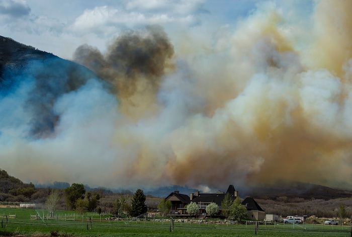 (Rick Egan  |  The Salt Lake Tribune)   A fire burns near Dutch Canyon Road in Midway, 
Tuesday May 12, 2020