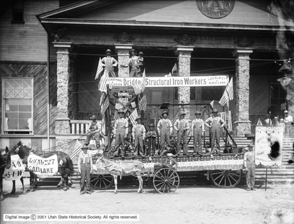 (Utah State Historical Society) Men standing on the iron workers float used during the 1906 Labor Day Parade.