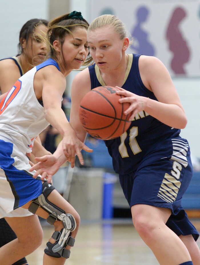 (Leah Hogsten  |  The Salt Lake Tribune) Skyline's Barrett Jessop (11) rounds Timpview's Jasmine Espinoza (10).  Timpview faces Skyline in their semifinal game of the 5A High School Girls' Basketball Tournament at SLCC in Taylorsville, Friday, Feb. 23, 2018. 