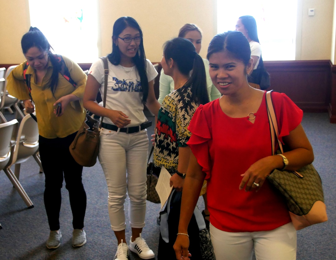 (Mike Stack  |  for The Salt Lake Tribune) LDS Filipino domestic workers socialize after Wednesday services.