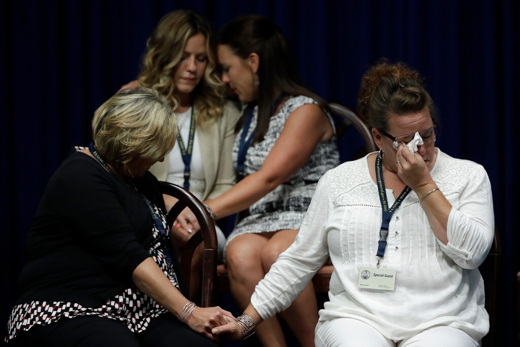 (Matt Rourke | AP) In this Aug. 14, 2018 file photo, victims of clergy sexual abuse, or their family members, react as Pennsylvania Attorney General Josh Shapiro speaks during a news conference at the State Capitol in Harrisburg, Pa. The child-protection policies adopted by Roman Catholic leaders to curb clergy sex abuse in the U.S. are inconsistent and often worryingly incomplete, according to the Philadelphia-based CHILD USA think tank’s 2018-2020 investigation of policies in all 32 archdioceses.