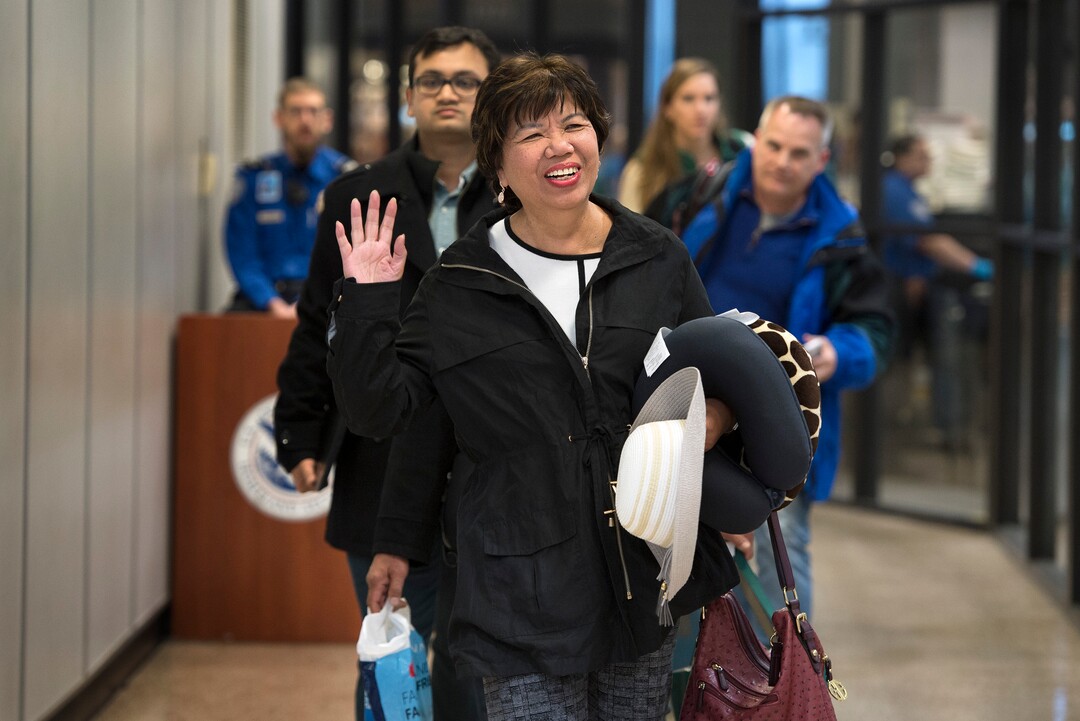 Scott Sommerdorf | The Salt Lake Tribune
Corazon Espinosa, waves to her sisters after arriving from Australia, via Los Angeles, Thursday, March 1, 2018. Espinosa, 70, has been trying to legally immigrate to the U.S. for 40 years. Her sisters Celeste Galbreath, Carolina Pangilinan and Teena Jensen were all there to greet her.