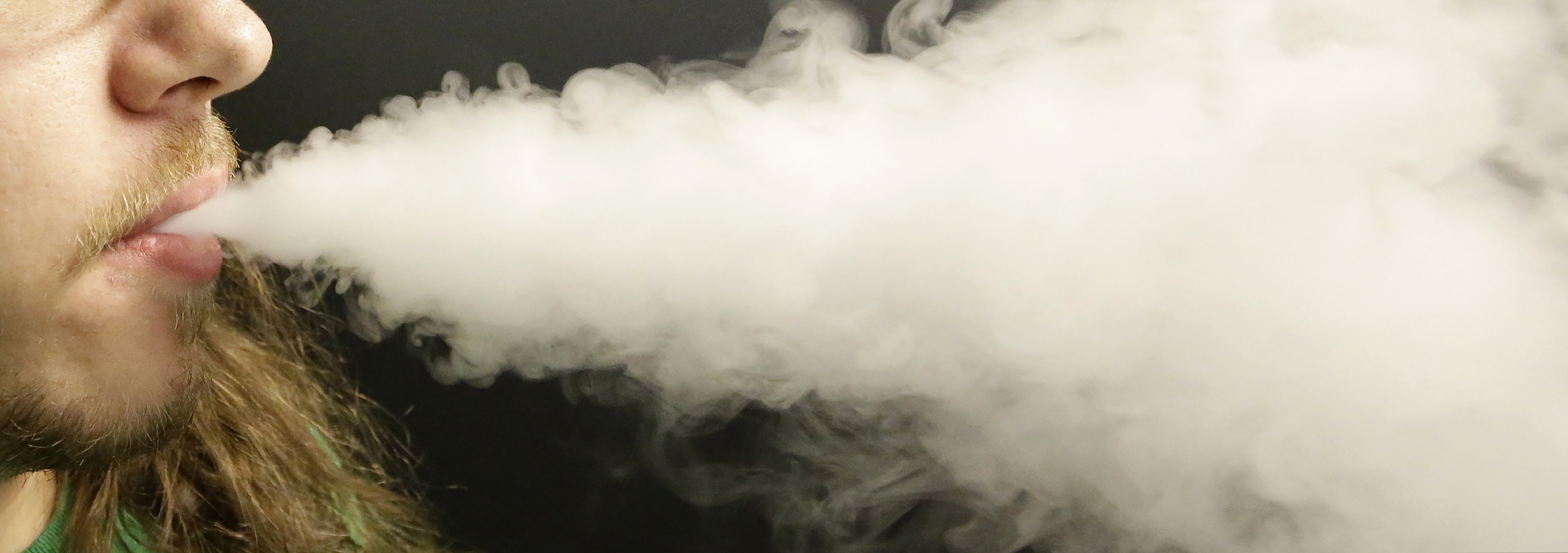 (Rick Bowmer | AP file photo)A man exhales vapor as he demonstrates the use of his electronic cigarette in Salt Lake City. Utah health officials say they have confirmed 47 cases of lung damage linked to vaping and are investigating 22 more potential cases.