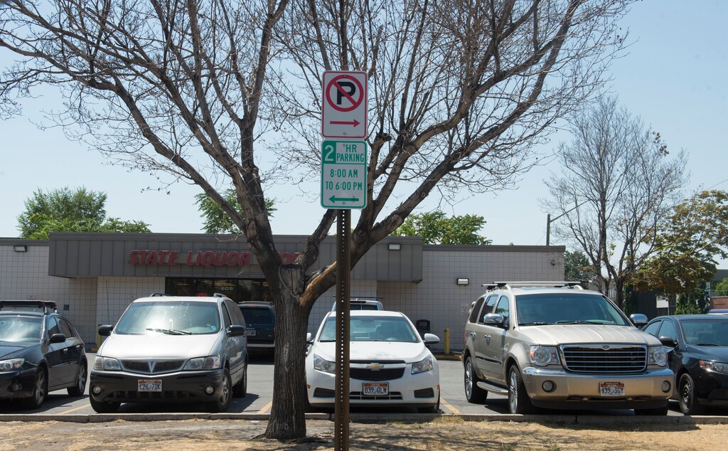 (Rick Egan | Tribune file photo) This July 6, 2017, file photo shows parking restriction sign on the street in front of the downtown Salt Lake City state liquor store on 200 West and 400 South. The city, which has resumed enforcing meter violations since August, will now expand this to include nonmetered parking.
