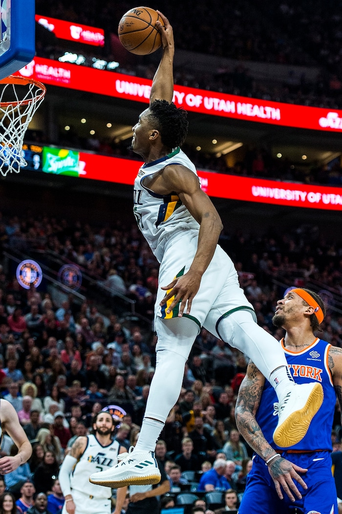 (Chris Detrick  |  The Salt Lake Tribune)  Utah Jazz guard Donovan Mitchell (45) goes up for a dunk past New York Knicks forward Michael Beasley (8) during the game at Vivint Smart Home Arena Friday, January 19, 2018.  Utah Jazz guard Donovan Mitchell (45) missed the dunk. 