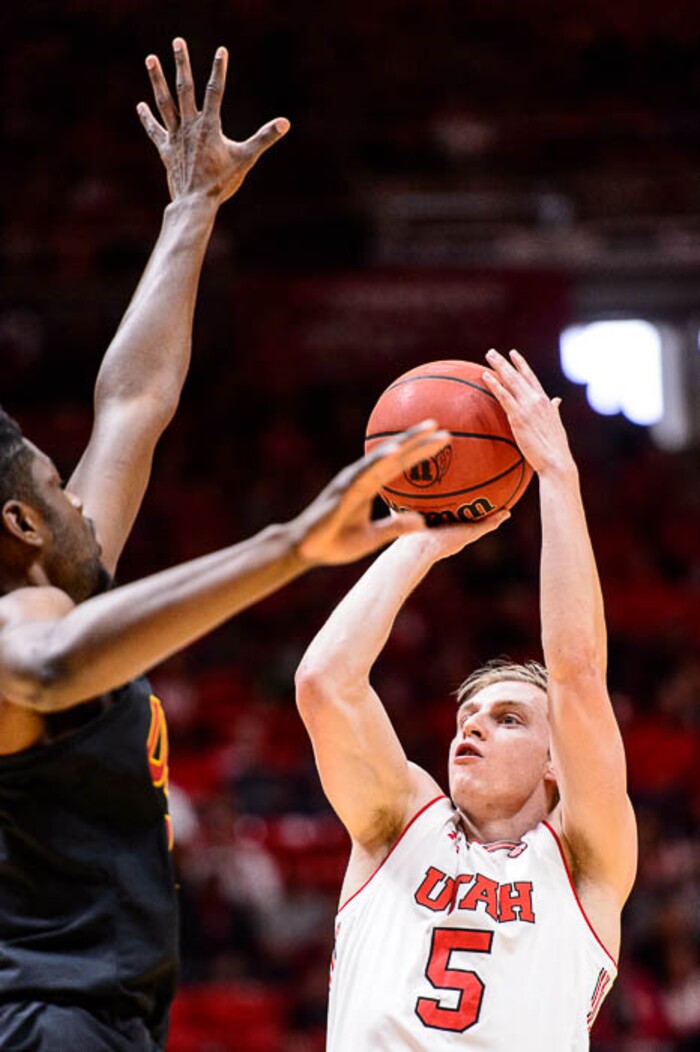 (Trent Nelson | The Salt Lake Tribune)  Utah Utes guard Parker Van Dyke (5) shoots over USC Trojans forward Chimezie Metu (4) as the University of Utah hosts USC, NCAA basketball at the Huntsman Center in Salt Lake City, Saturday Feb. 24, 2018.