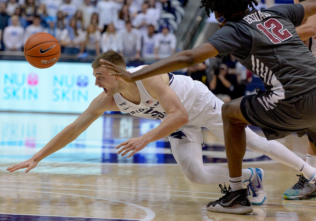 (Francisco Kjolseth  |  The Salt Lake Tribune) Brigham Young Cougars guard Jake Toolson (5) tries to chase down a loose ball ahead of Santa Clara Broncos center Jaden Bediako (12) in the second half as the Brigham Young Cougars host the Santa Clara Broncos at the Marriott Center in Provo, Thursday, Feb. 20, 2020. BYU won 85-75.