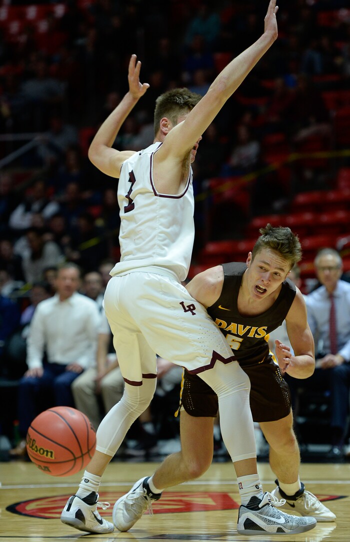 (Francisco Kjolseth  |  The Salt Lake Tribune)  Davis vs Lone Peak, 6A State high school basketball tournament at the Huntsman Center in Salt Lake City, Thursday March 1, 2018. Josh Sanders (5) loses the ball through the legs of Max Brenchley (1). 