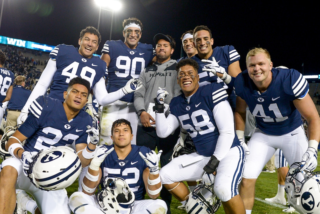 Leah Hogsten  |  The Salt Lake Tribune  Brigham Young players pose with former BYU player Va'a Niumatalolo, who is now a graduate assistant at Hawaii after the game at Lavell Edwards Stadium in Provo, Saturday Oct. 13, 2018. BYU defeated Hawaii 49-23.
