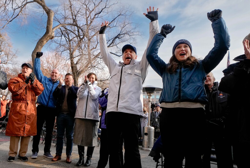 (Francisco Kjolseth  |  The Salt Lake Tribune) Fraser Bullock, center, president and CEO of the Salt Lake City-Utah Committee for the Games and Salt Lake City Mayor Erin Mendenhall celebrate at City Hall on Wednesday, Nov. 29, 2023, following the announcement by the International Olympic Committee of Salt Lake as a "preferred host" of the 2034 Olympic Games following an IOC live broadcast from Paris. Also pictured from left are Olympic organizers Spencer Eccles, Utah Gov. Spencer Cox, Steve Starks and Catherine Raney-Norman. 
