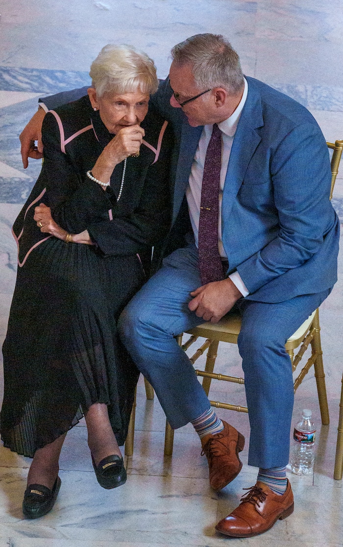 (Leah Hogsten | The Salt Lake Tribune)  Jaime Whitlock, right, accompanies his mother-in-law Elaine Hatch during the public viewing for her husband, former U.S. Sen. Orrin Hatch at the Utah Capitol on Wednesday, May 4, 2022. Hatch, the longest-serving Republican senator in U.S. history and the longest-serving from Utah, died April 23 at age 88.
