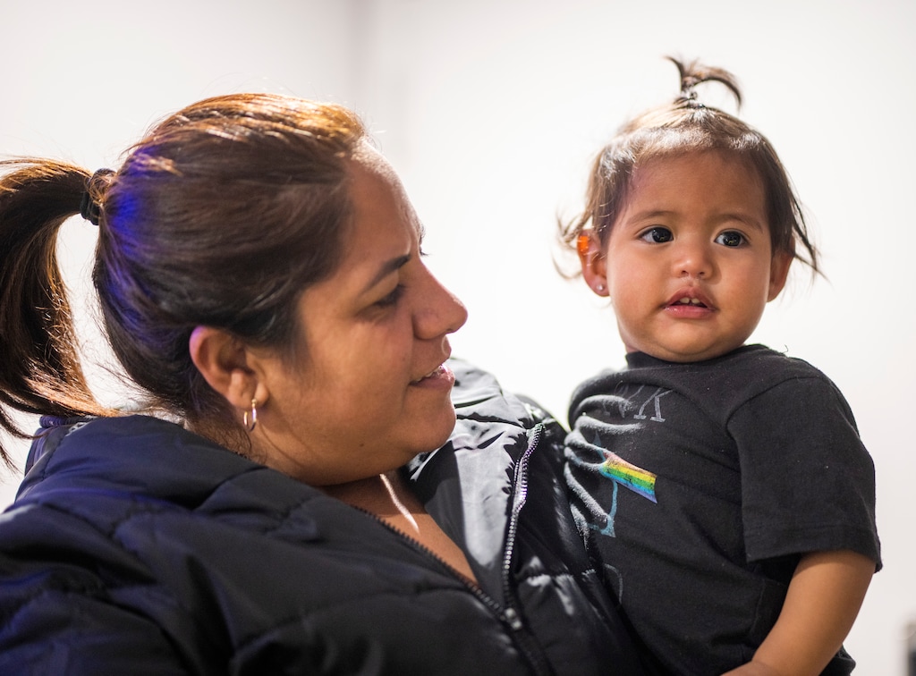 (Rick Egan | The Salt Lake Tribune) Yulianny Escudero with her 1-year-old granddaughter, Aranza, in a Salt Lake City motel on Tuesday, Feb. 13, 2024.