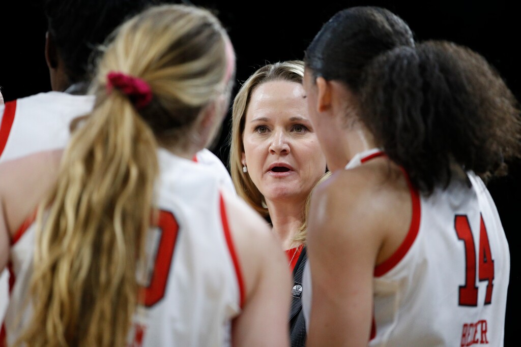 Utah head coach Lynne Roberts speaks with her players during the second half of an NCAA college basketball game against Washington in the first round of the Pac-12 women's tournament Thursday, March 5, 2020, in Las Vegas. (AP Photo/John Locher)