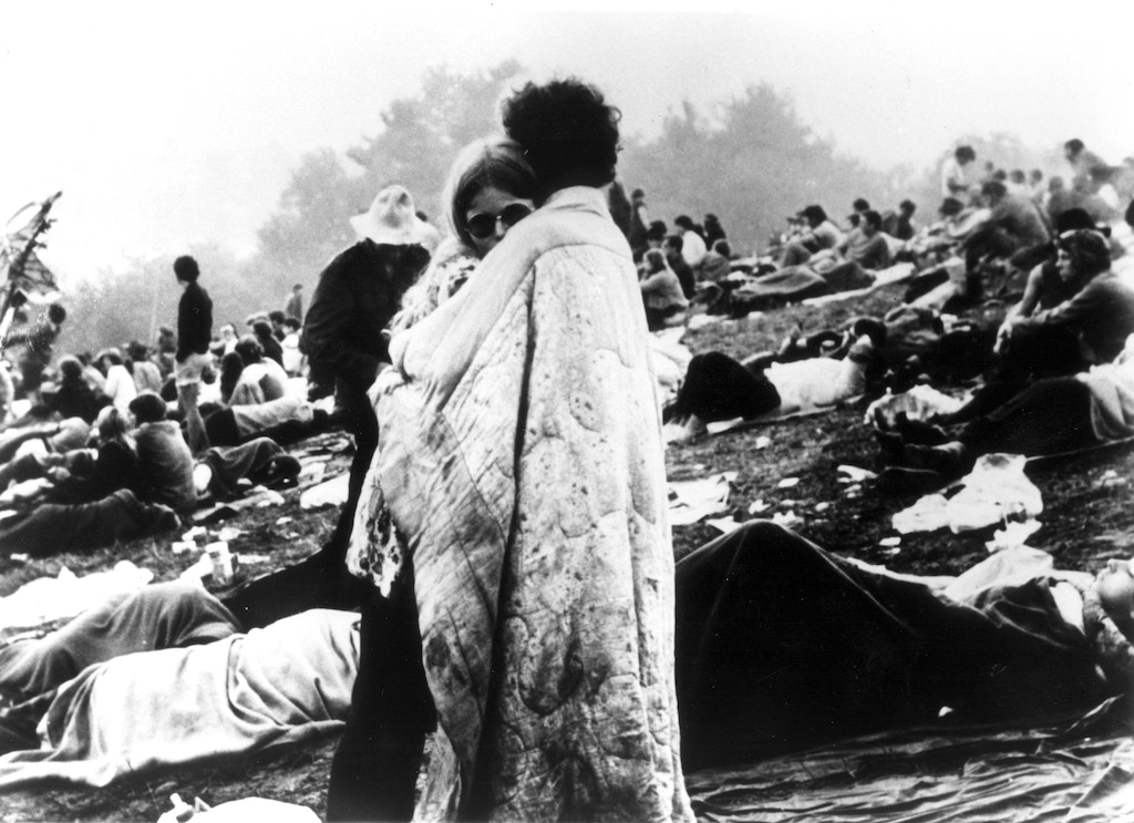 A couple embraces during the historic Woodstock concert in 1969.  (AP-Photo)