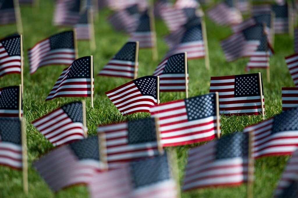 (Rick Egan  |  The Salt Lake Tribune)   3000 flags wave in the grass in front of Skyline High School in memory of those who lost their lives 17 years ago.  Tuesday, Sept. 11, 2018.