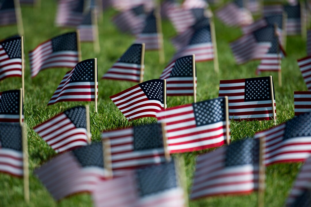 (Rick Egan  |  The Salt Lake Tribune)   3000 flags wave in the grass in front of Skyline High School in memory of those who lost their lives 17 years ago.  Tuesday, Sept. 11, 2018.