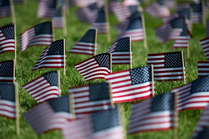 (Rick Egan | The Salt Lake Tribune) 3000 flags wave in the grass in front of Skyline High School in memory of those who lost their lives 17 years ago. Tuesday, Sept. 11, 2018.