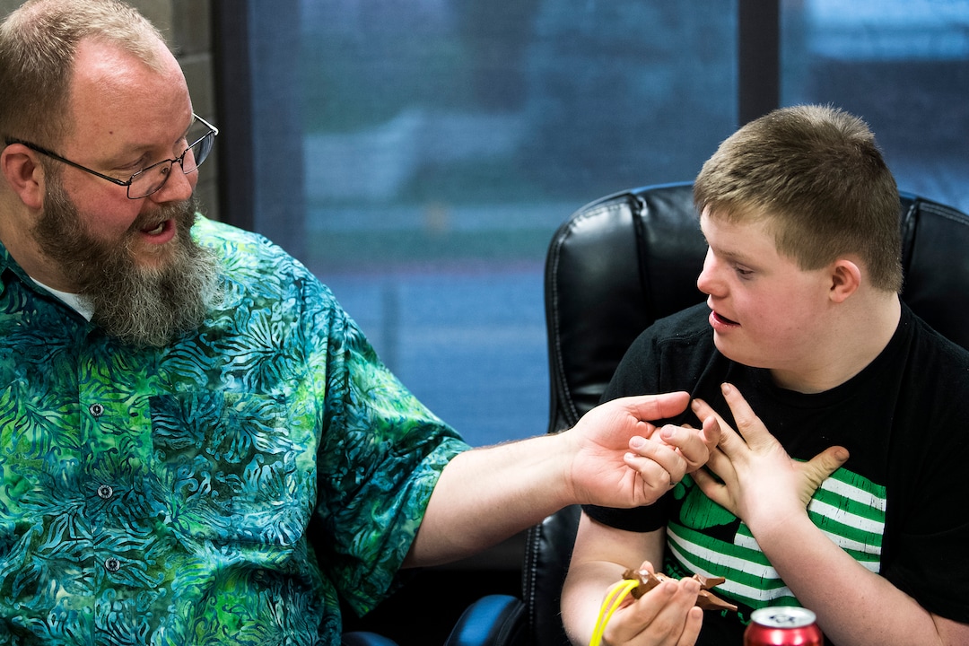 (Chris Detrick  |  The Salt Lake Tribune)  Chad Blythe and his son Logan, 15, talk during an interview at VF Law in Salt Lake City Friday, March 16, 2018. 