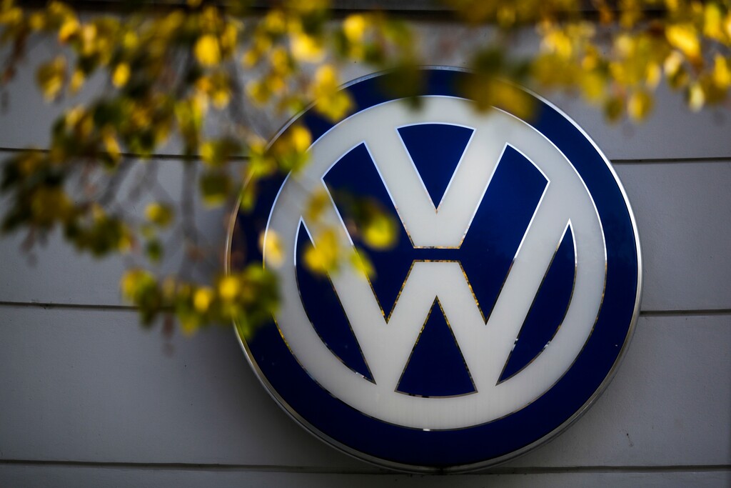 (AP Photo/Markus Schreiber, File) In this Oct. 5, 2015, file photo, the VW sign of Germany's Volkswagen car company is displayed at the building of a company's retailer in Berlin.