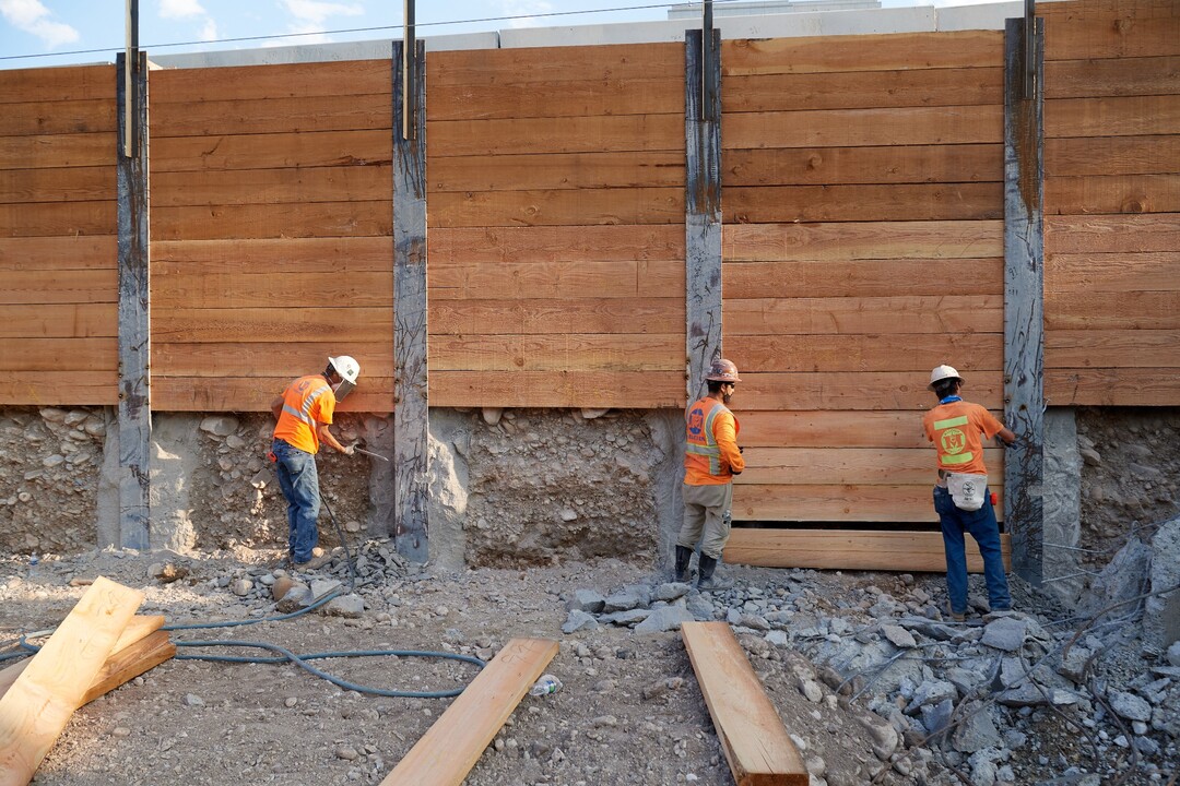 (Photo courtesy The Church of Jesus Christ of Latter-day Saints) In this August 2020 photos, crews install 4-inch-thick wood lagging as part of a construction site retaining wall surrounding the temple grounds. The lagging will eventually go to a depth of 40 feet after excavation is completed. A cable system helps lock the lagging in place to provide additional stability.