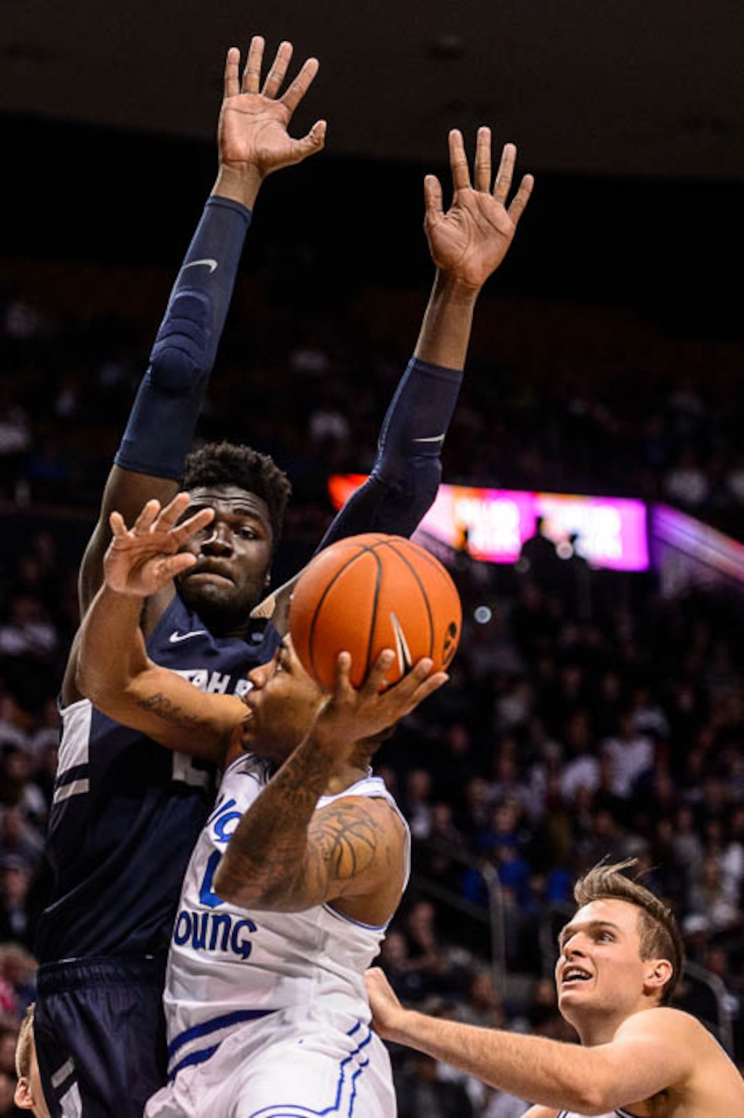 (Trent Nelson | The Salt Lake Tribune)  Brigham Young Cougars guard Jahshire Hardnett (0) shoots with Utah State Aggies center Neemias Queta (23) defending as BYU hosts Utah State, NCAA basketball in Provo on Wednesday Dec. 5, 2018.