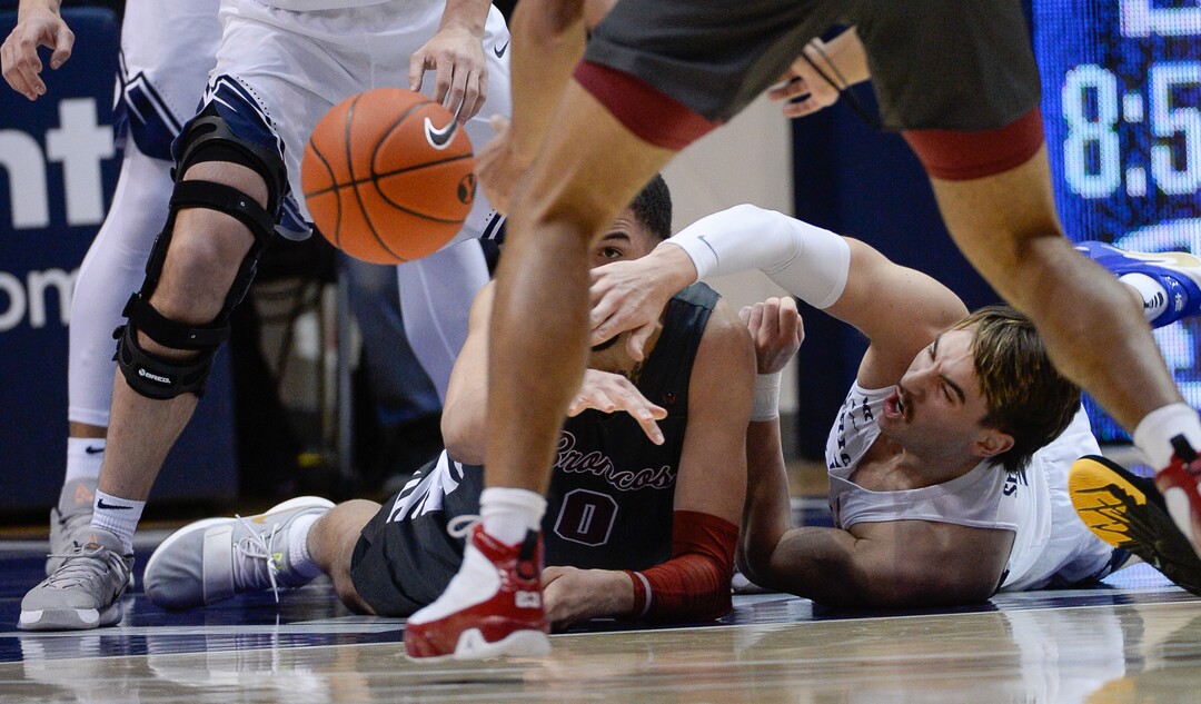 (Francisco Kjolseth  |  The Salt Lake Tribune) Santa Clara Broncos forward DJ Mitchell (0) battles Brigham Young Cougars guard Zac Seljaas (2) for a loose ball in the first half as the Brigham Young Cougars host the Santa Clara Broncos at the Marriott Center in Provo, Thursday, Feb. 20, 2020.