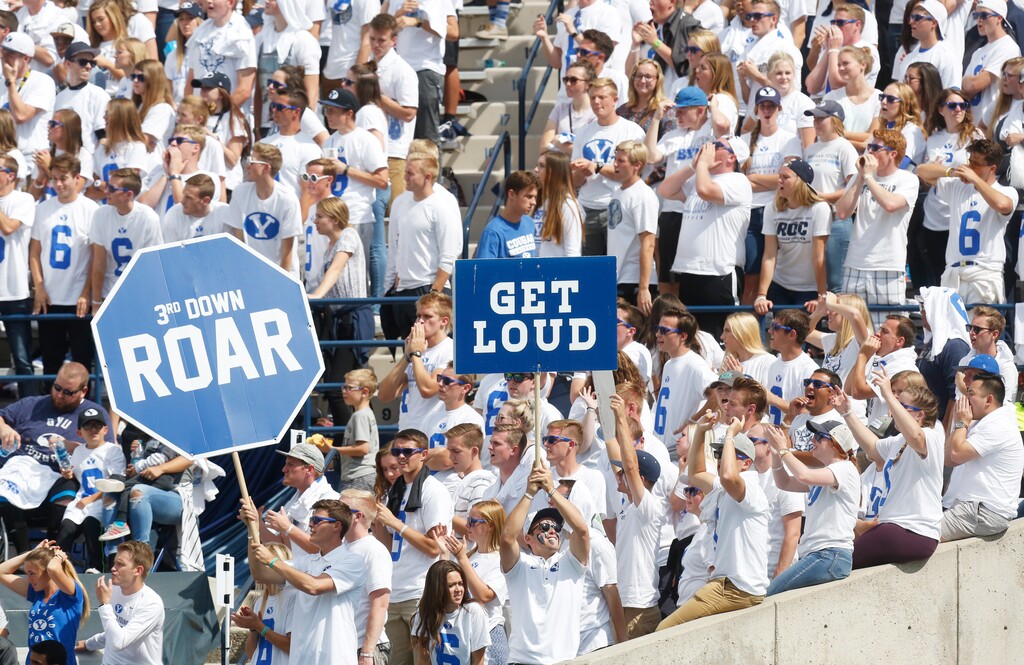 FILE - In this Sept. 16, 2017, file photo, BYU fans cheer in the first half during an NCAA college football game against Wisconsin, in Provo, Utah. The friendly confines of LaVell Edwards Stadium will have fans for the first time this season when No. 12 BYU faces Texas State on Saturday., Oct. 24, 2020. Cougars coach Kalani Sitake has a message for the approximately 6,000 who show up: Be loud. Be very, very loud. Make it seem like 60,000.(AP Photo/Kim Raff, File)