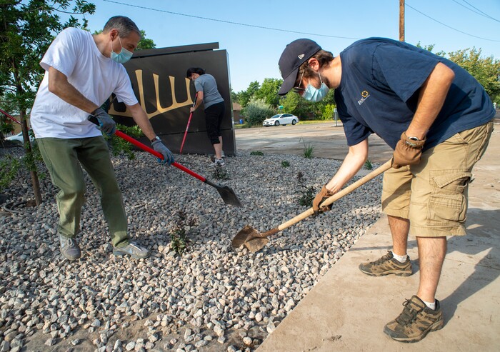 (Rick Egan  |  The Salt Lake Tribune)      Chris Juchau, Stake President of the Church of Jesus Christ of Latter Day Saints Highland Utah South Stake left, spreads rocks with Rabbi Sam Spector of Congregation Kol Ami, right, as Juchau and members of his stake help xeriscape the grounds around the building on Wednesday, Aug. 5, 2020.