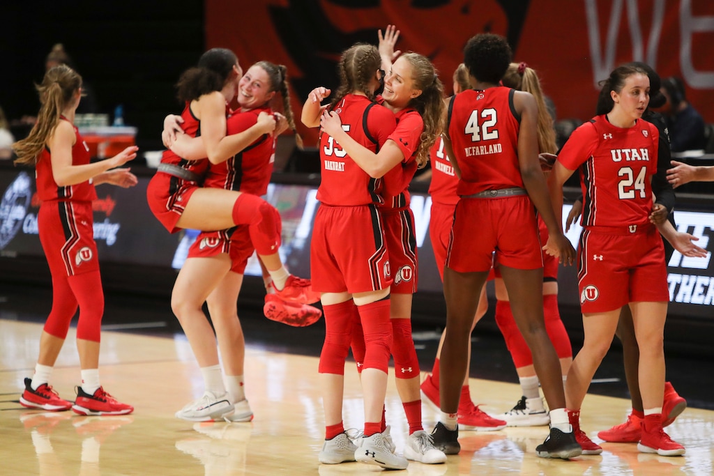 Utah players celebrate their win over Oregon State following an NCAA basketball game on Tuesday, Dec. 8, 2020, in Corvallis, Ore. Utah won 85-79. (AP Photo/Amanda Loman)