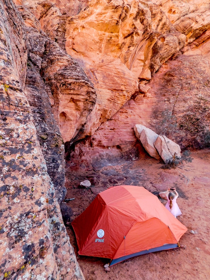 Erin Alberty | The Salt Lake Tribune
A young camper takes pictures of the colorful sandstone that surrounds Sand Cove Primitive Campground on April 1, 2017 in the Red Cliffs Desert Reserve near Leeds.