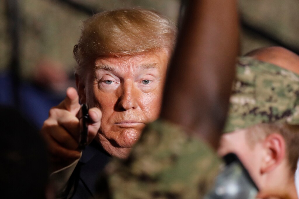 (Eugene Hoshiko | AP Photo) U.S. President Donald Trump gestures to U.S. servicemen at U.S. Navy multipurpose amphibious assault ship USS Wasp at the U.S. Navy's Yokosuka base in Yokosuka, south of Tokyo Tuesday, May 28, 2019.