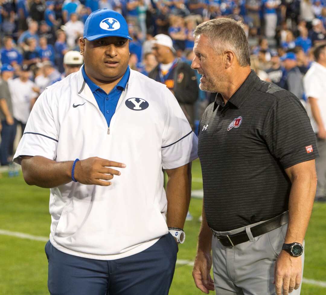 (Rick Egan  |  The Salt Lake Tribune)  Brigham Young Cougars head coach Kalani Satike chats with Utah Utes head coach Kyle Whittingham before the big game at Lavell Edwards Stadium in Provo, Saturday, September 9, 2017.