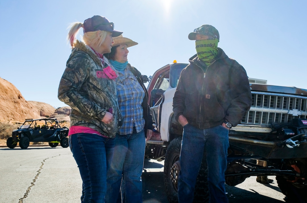 (Leah Hogsten | The Salt Lake Tribune)  Kent Green, right, an area off-road guide who runs the tour company Moab Cowboy Country Offroad Adventures, prepares to ride the Sand Flats Recreation Area trail Hell's Revenge with his wife Cricket and daughter Amasie Willison for trail resortation and repairs, Feb. 20, 2021.