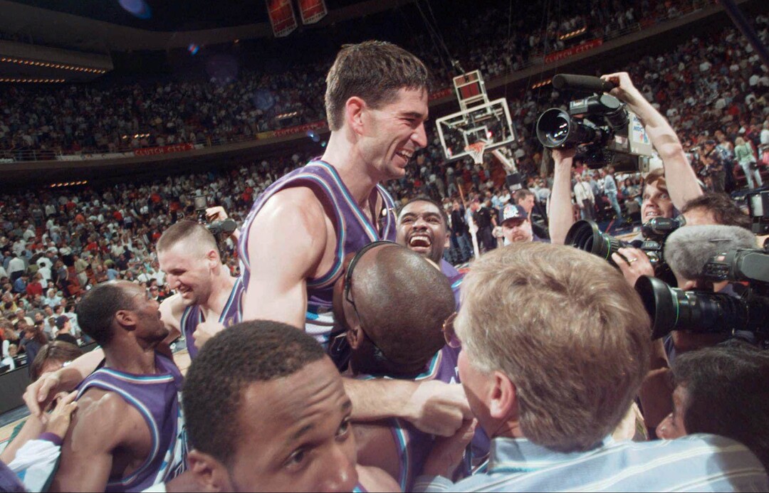 (Tribune file photo) Utah Jazz's John Stockton is lifted on the shoulders of his teammates after sinking a three-point shot at the buzzer to beat the Houston Rockets 103-100 in Game 6 of the Western Conference Finals Thursday, May 29, 1997, in Houston. The Jazz advanced to play the Chicago Bulls in The NBA Finals.